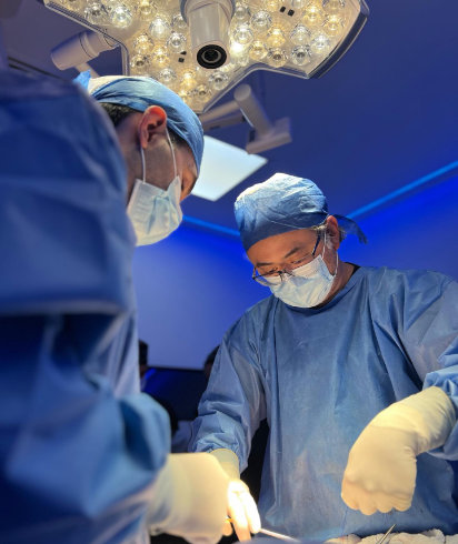 doctors operate surgery in OR